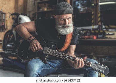 concentrated-elder-man-holding-instrument-260nw-695437432.jpg