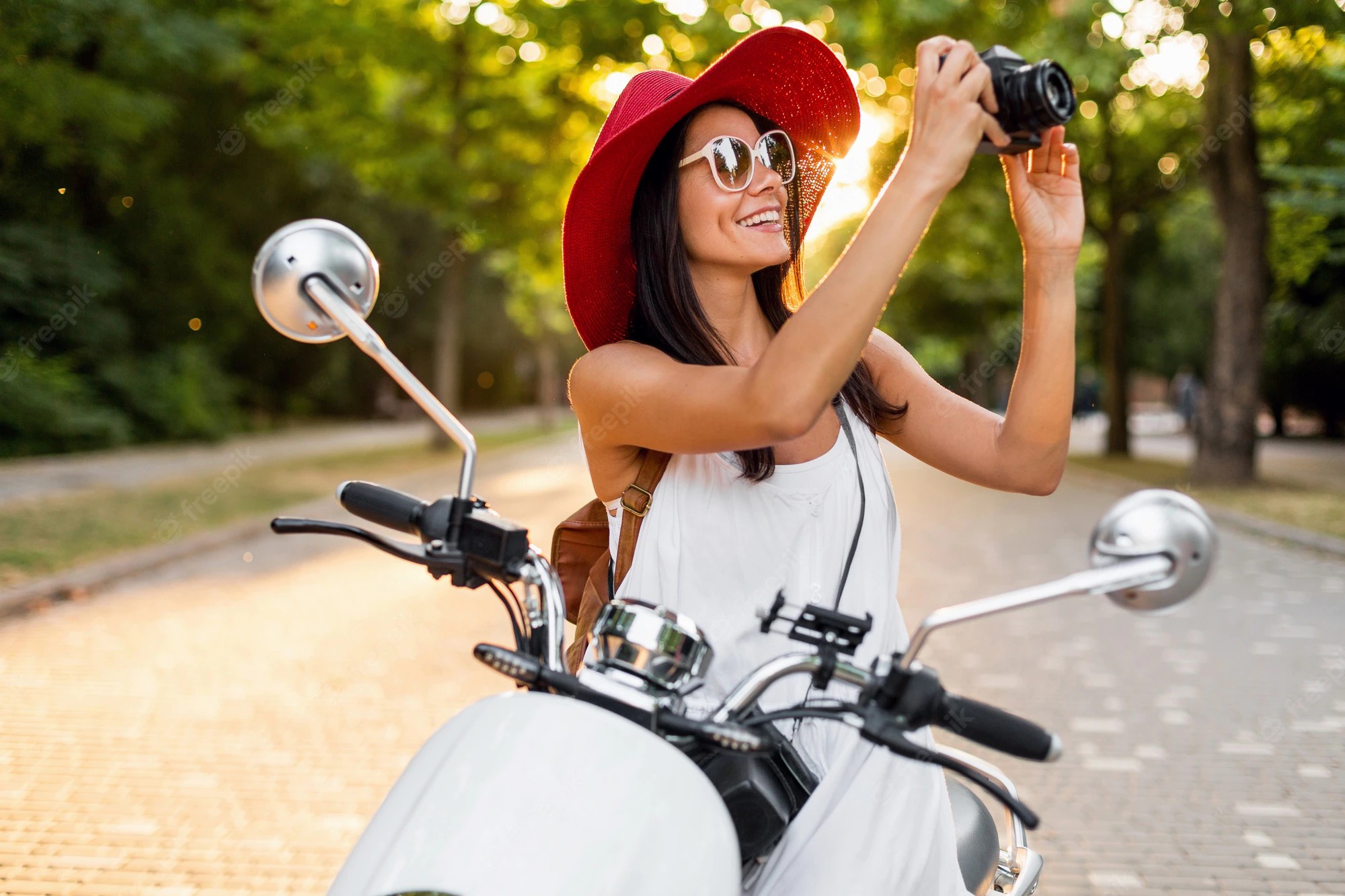 attractive-smiling-woman-riding-motorbike-street-summer-style-outfit-wearing-white-dress-red-hat-traveling-vacation-taking-pictures-vintage-photo-camera_285396-4665.jpg