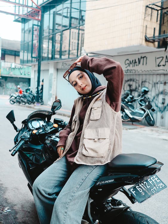 free-photo-of-girl-in-hijab-sitting-on-motorbike-on-street.jpeg