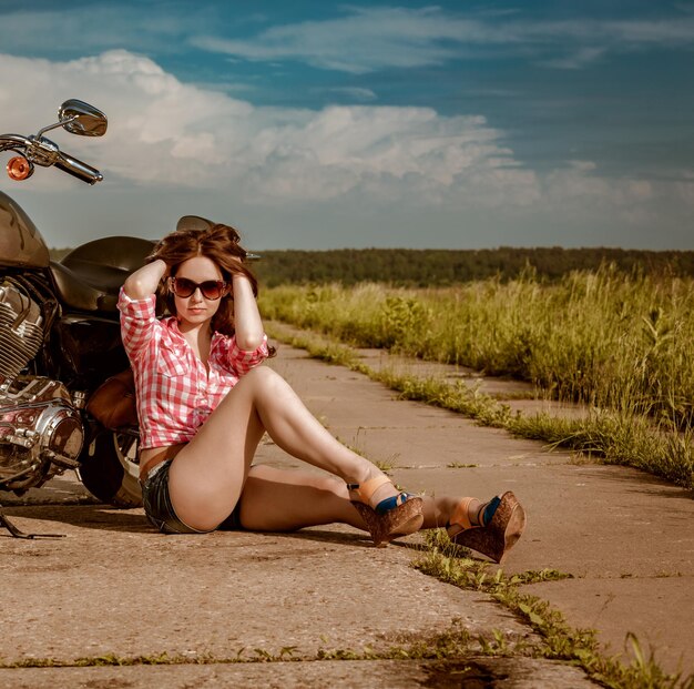 biker-girl-with-sunglasses-motorcycle_564276-11823.jpg