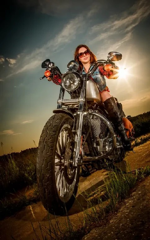 biker-girl-sitting-motorcycle-sunglasses-31623358~1.jpg