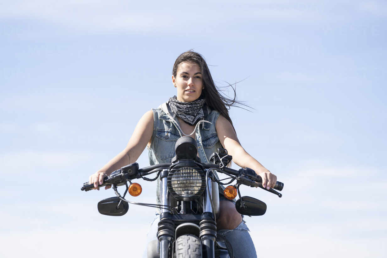 young-beautiful-woman-riding-motorbike-DAMF00332.jpg