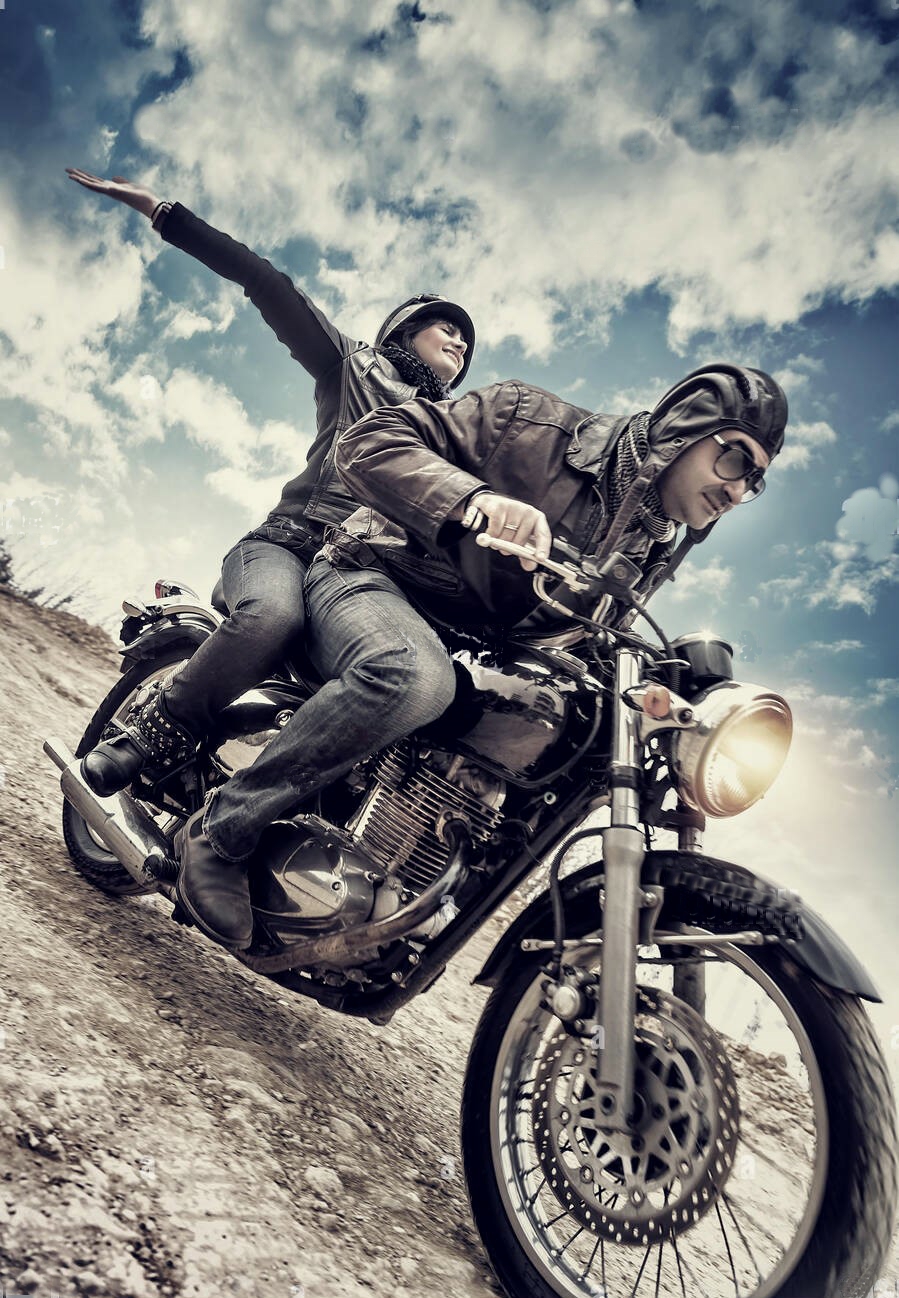 active-couple-on-motorcycle-happy-woman-riding-with-raised-up-hands-E5M6AX.jpg