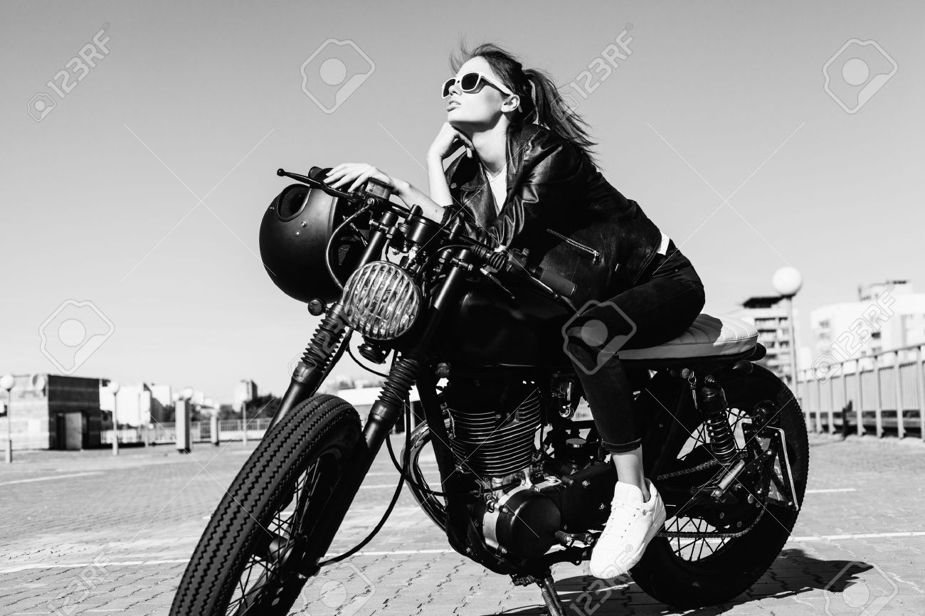 45824698-biker-girl-sitting-on-vintage-custom-motorcycle-black-white-outdoor-lifestyle-portrait.jpg