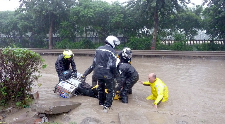 Riding-a-motorcycle-in-a-flood.png