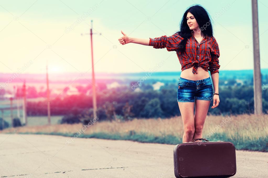 depositphotos_111343000-stock-photo-girl-with-retro-suitcase-standing.jpg